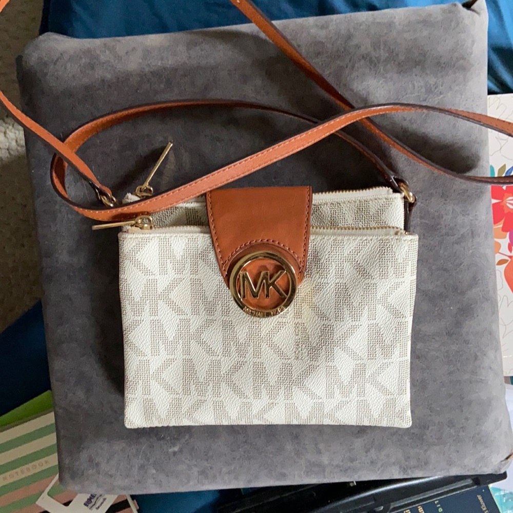 Cream-colored Michael Kors crossbody bag